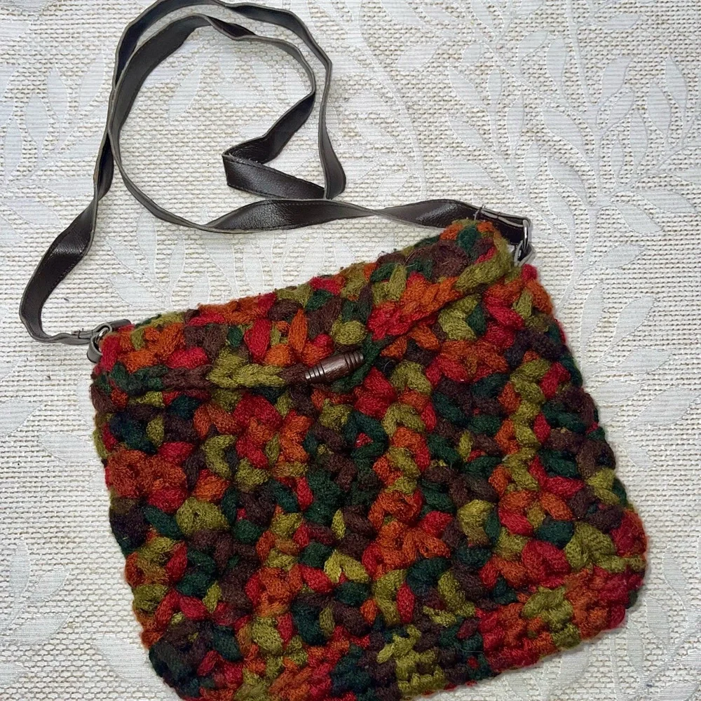 crossbody bag made with funky chunky, variegated yarn toggle closure